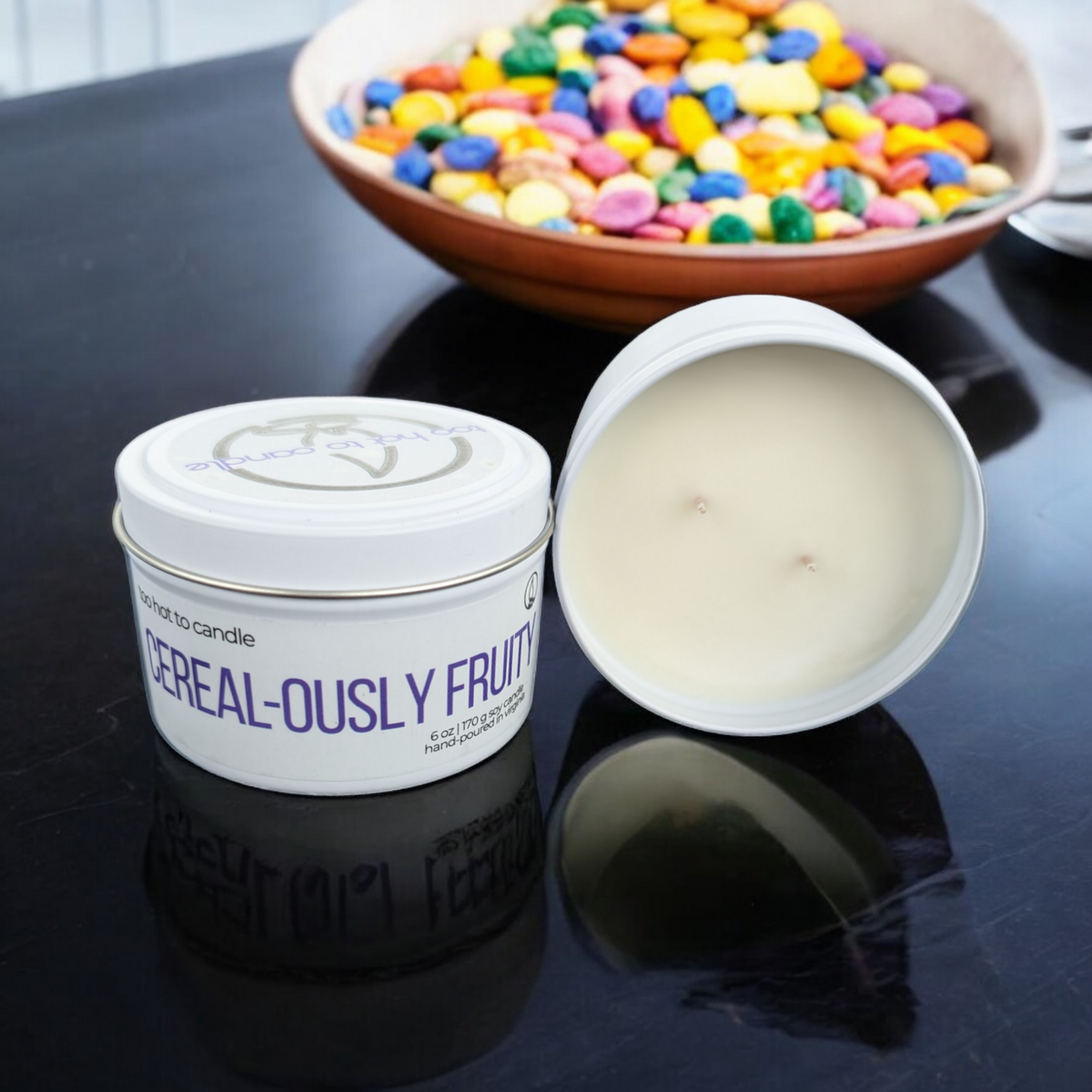 'Cereal-ously Fruity' candle with a bowl of rainbow cereal.