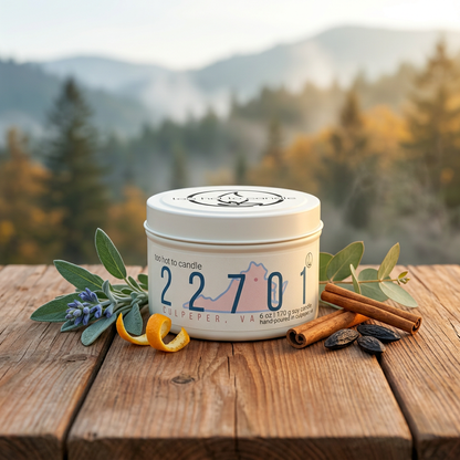 22701 6 oz candle tin in a woodland-inspired setting