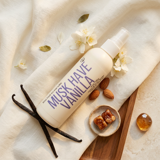 Musk Have Vanilla Spray flat lay with vanilla, jasmine, and warm amber accents