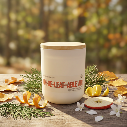 Un-be-leaf-able Air 13 oz candle with greenery, citrus, and autumn leaves